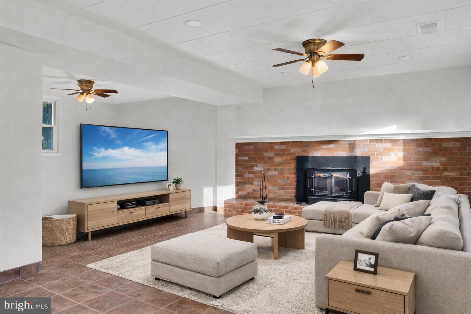 4224 Kinmount Road Lanham, MD 20706 - Photo 30 of 45 a living room with furniture and a flat screen tv