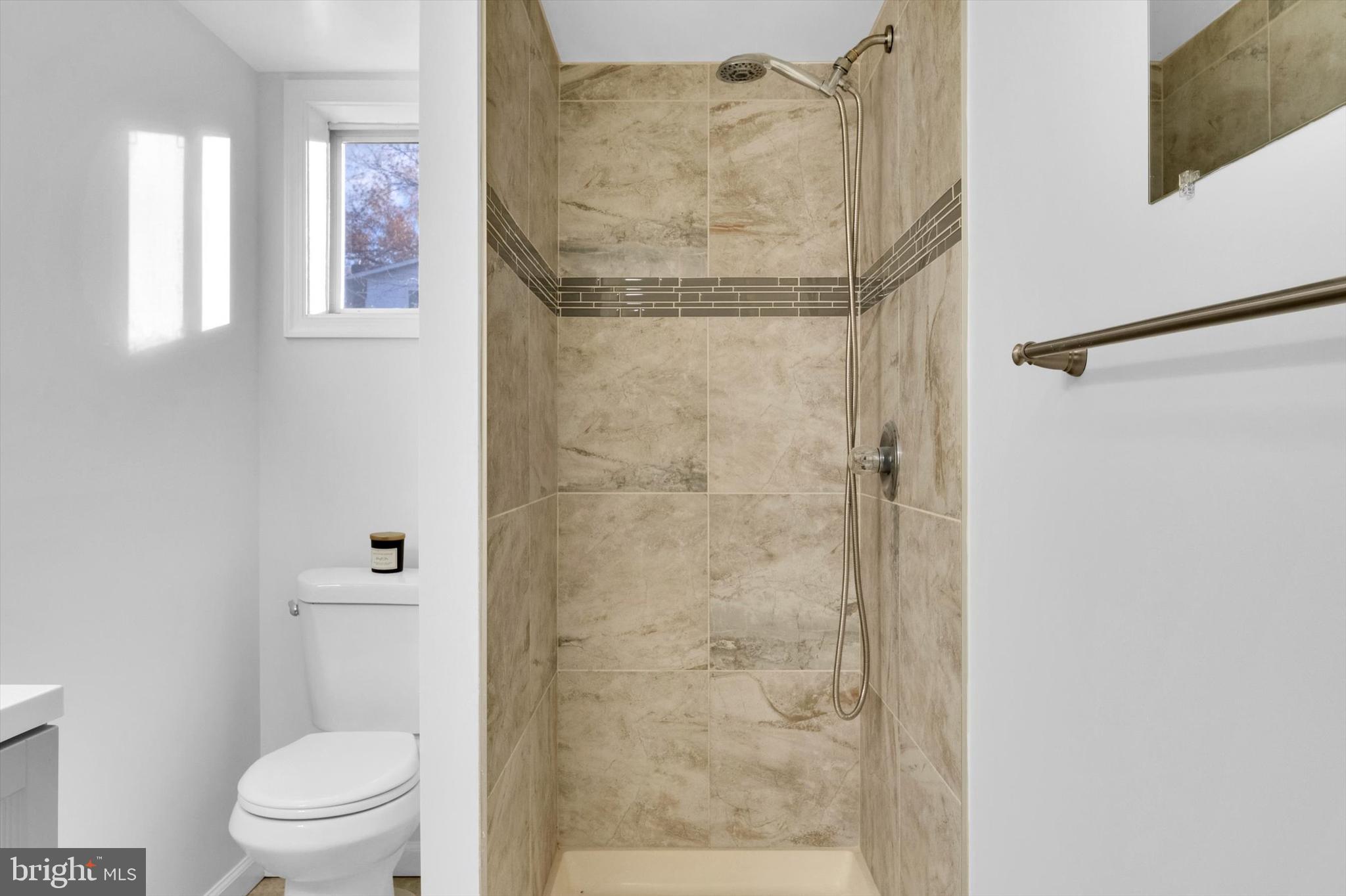 4224 Kinmount Road Lanham, MD 20706 - Photo 33 of 45 a bathroom with a shower and a toilet