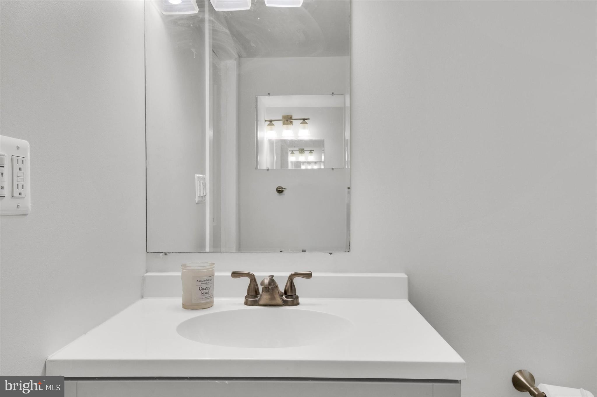 4224 Kinmount Road Lanham, MD 20706 - Photo 34 of 45 a bathroom with a sink and a mirror