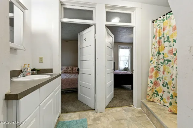 a kitchen with a refrigerator and cabinets