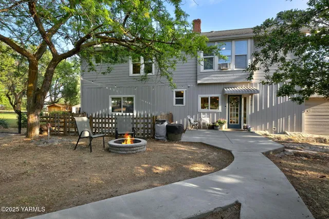 a backyard of a house with seating space