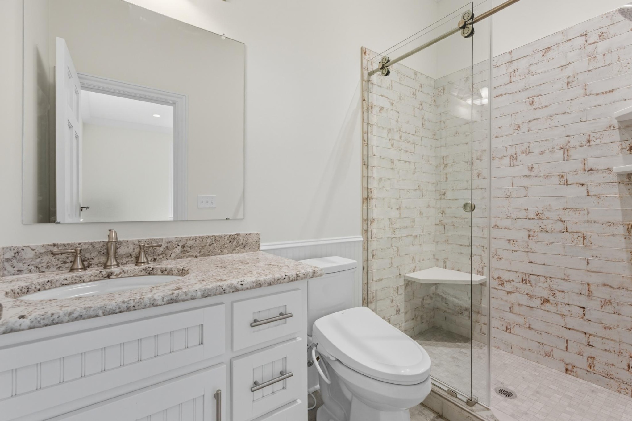 583 Bell Point Road Laceys Spring, AL 35754 - Photo 34 of 50 a bathroom with a granite countertop toilet sink shower and mirror