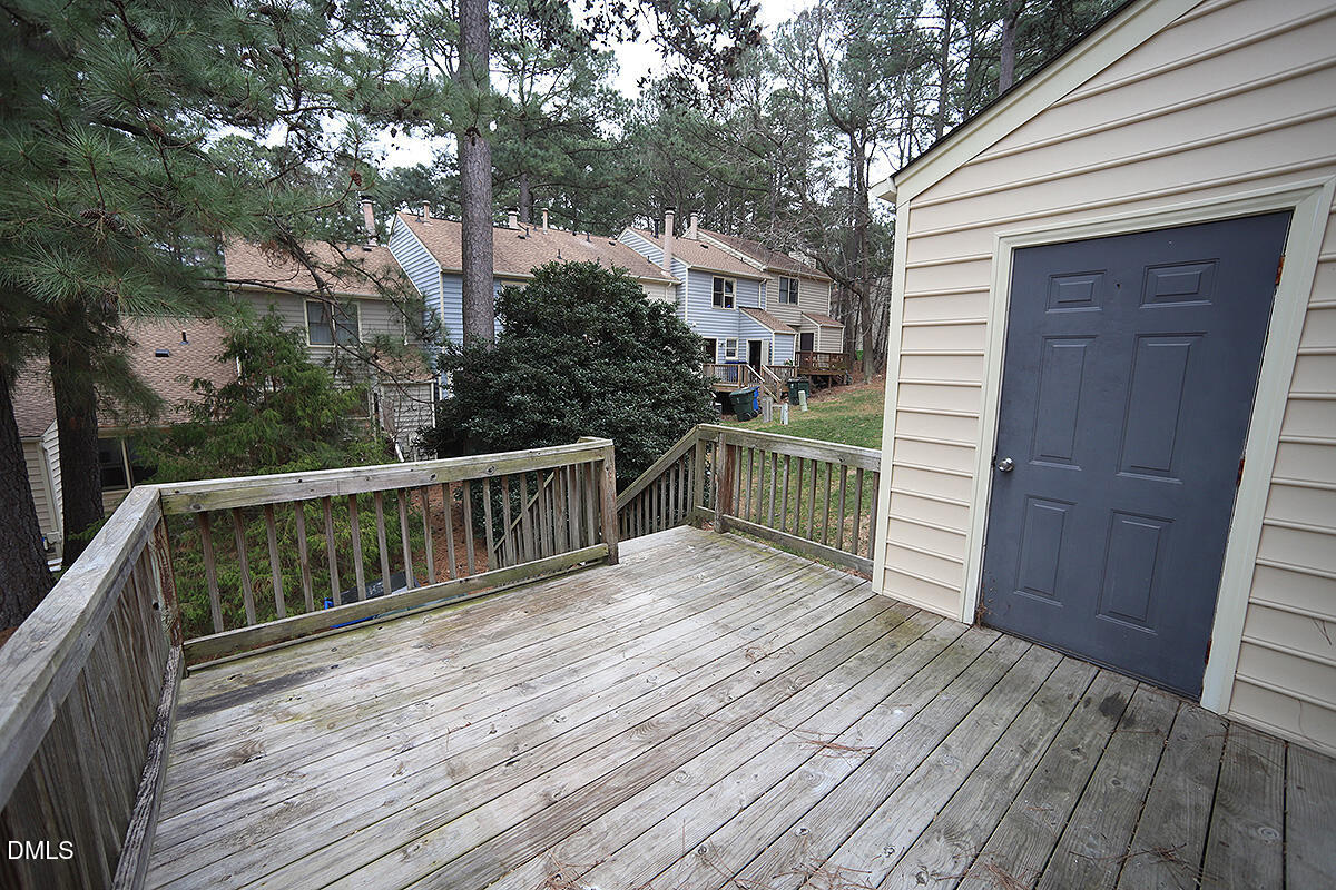 6514 Hearthstone Drive Raleigh, NC 27615 - Photo 15 of 16 a balcony with wooden floor and fence