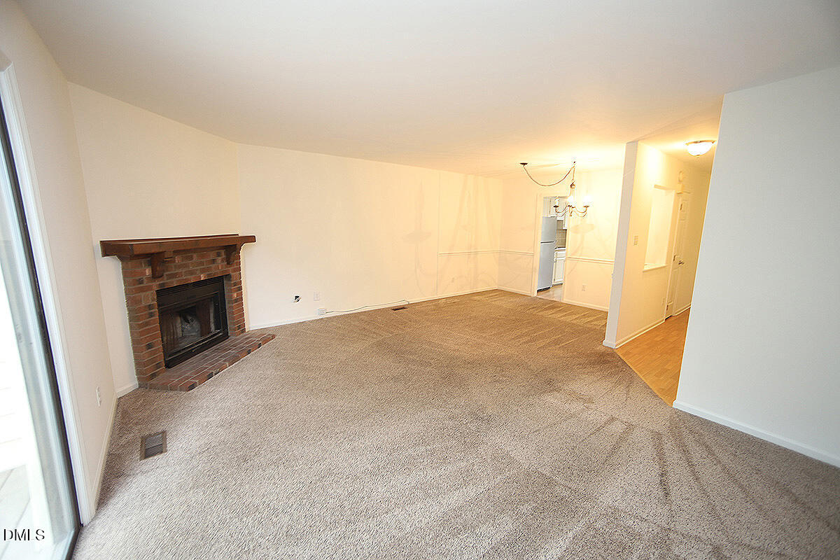 6514 Hearthstone Drive Raleigh, NC 27615 - Photo 8 of 16 a view of empty room with wooden floor