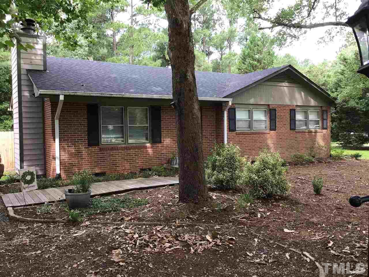 4802 Revere Road Durham, NC 27713 - Photo 3 of 29 a front view of a house with garden