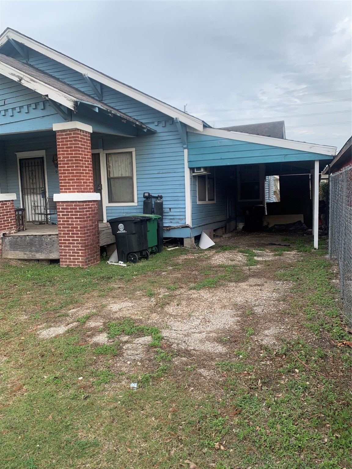 5001 Sherman Street Houston, TX 77011 - Photo 12 of 23 a view of a house with backyard and porch