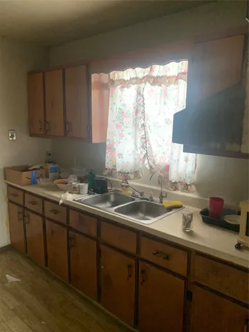 a kitchen with a sink and a microwave