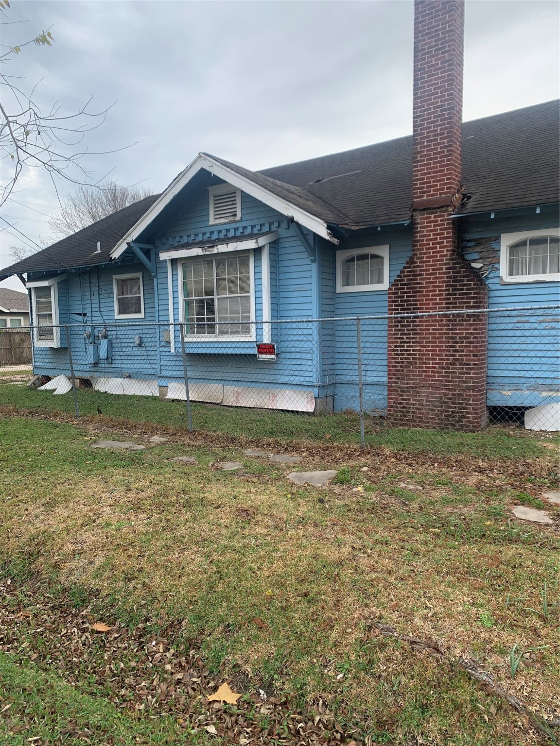 5001 Sherman Street Houston, TX 77011 - Photo 2 of 23 a front view of a house with a yard