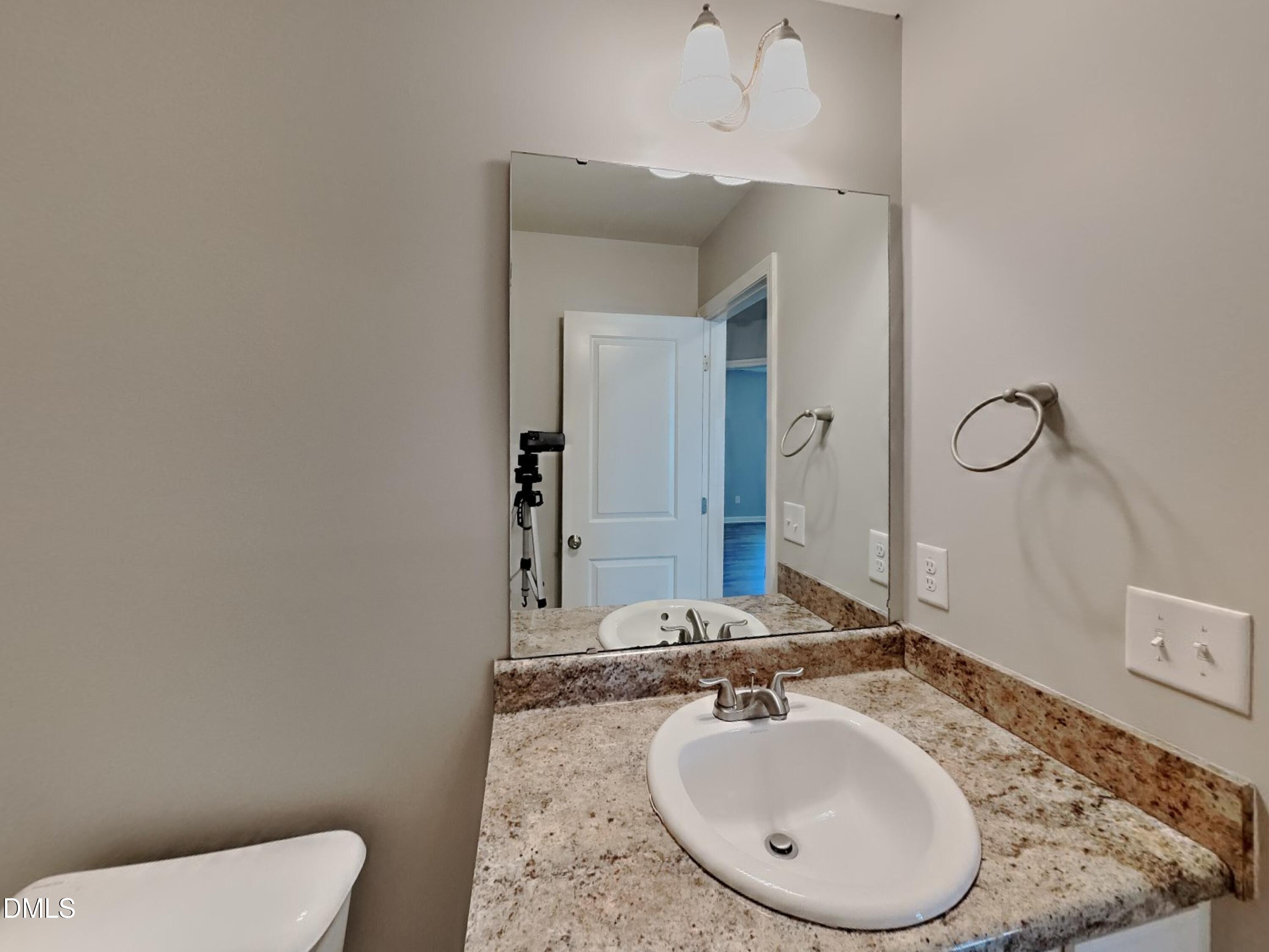 123 Willow Ridge Circle Willow Spring, NC 27592 - Photo 13 of 15 a bathroom with a granite countertop sink and a mirror