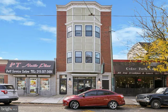 a front view of a building with parking space