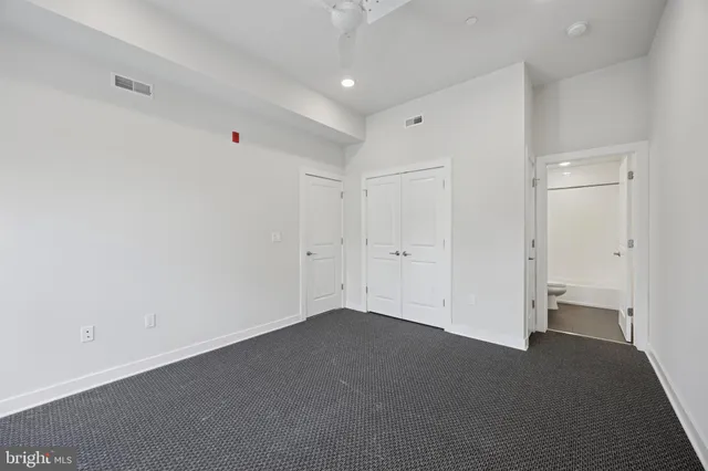 a view of a hallway with washer and dryer