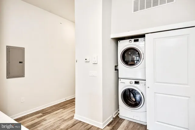 a stove top oven sitting inside of a kitchen