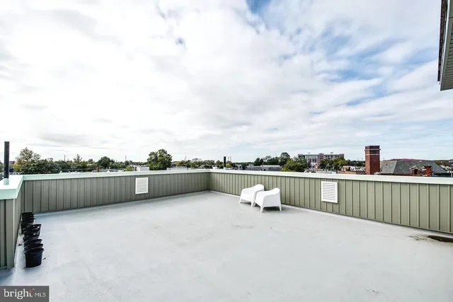 a view of a refrigerator with wooden floor