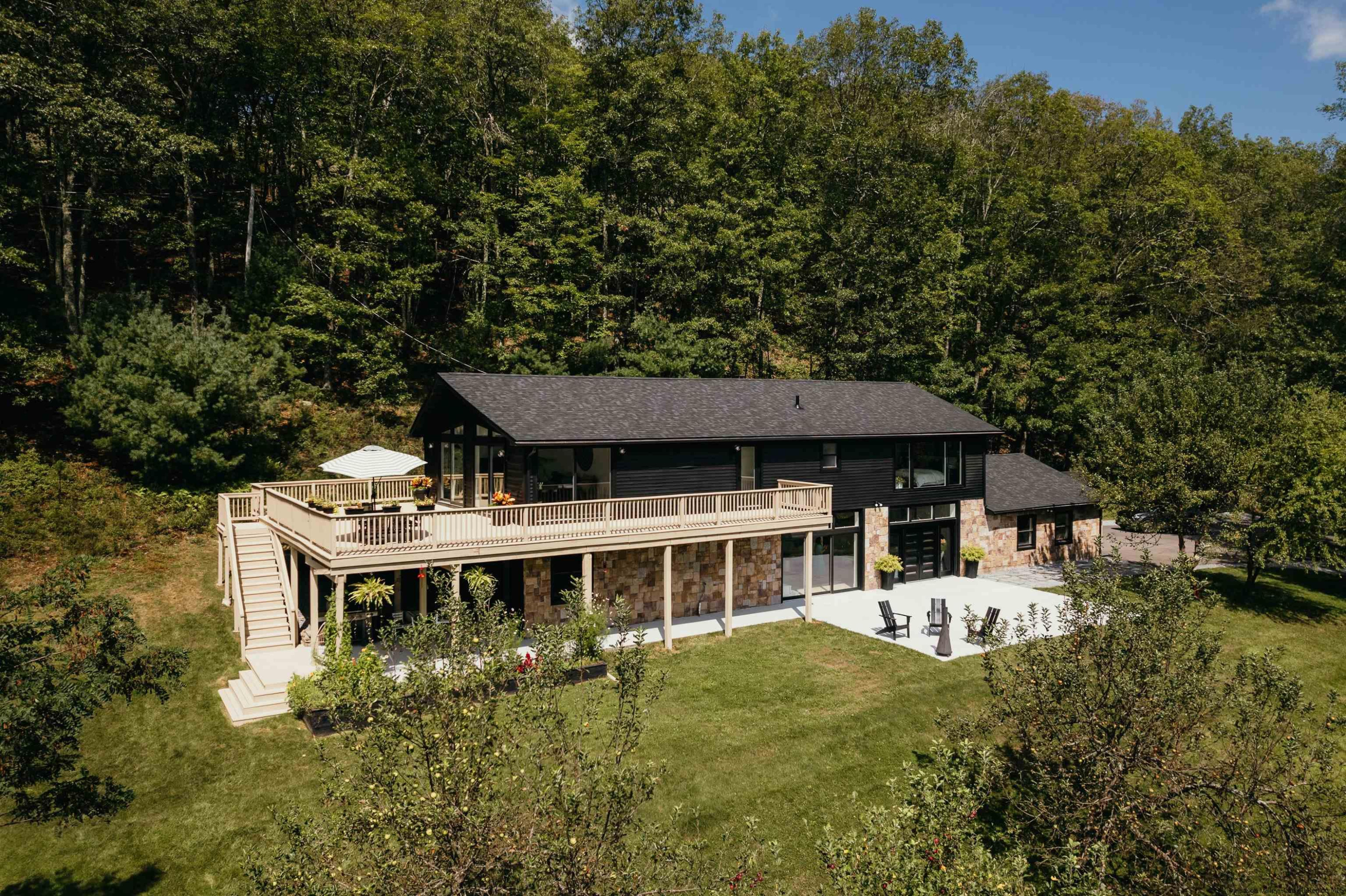 187 Bloom Road Barryville, NY 12719 - Photo 1 of 35 a backyard of a house with table and chairs