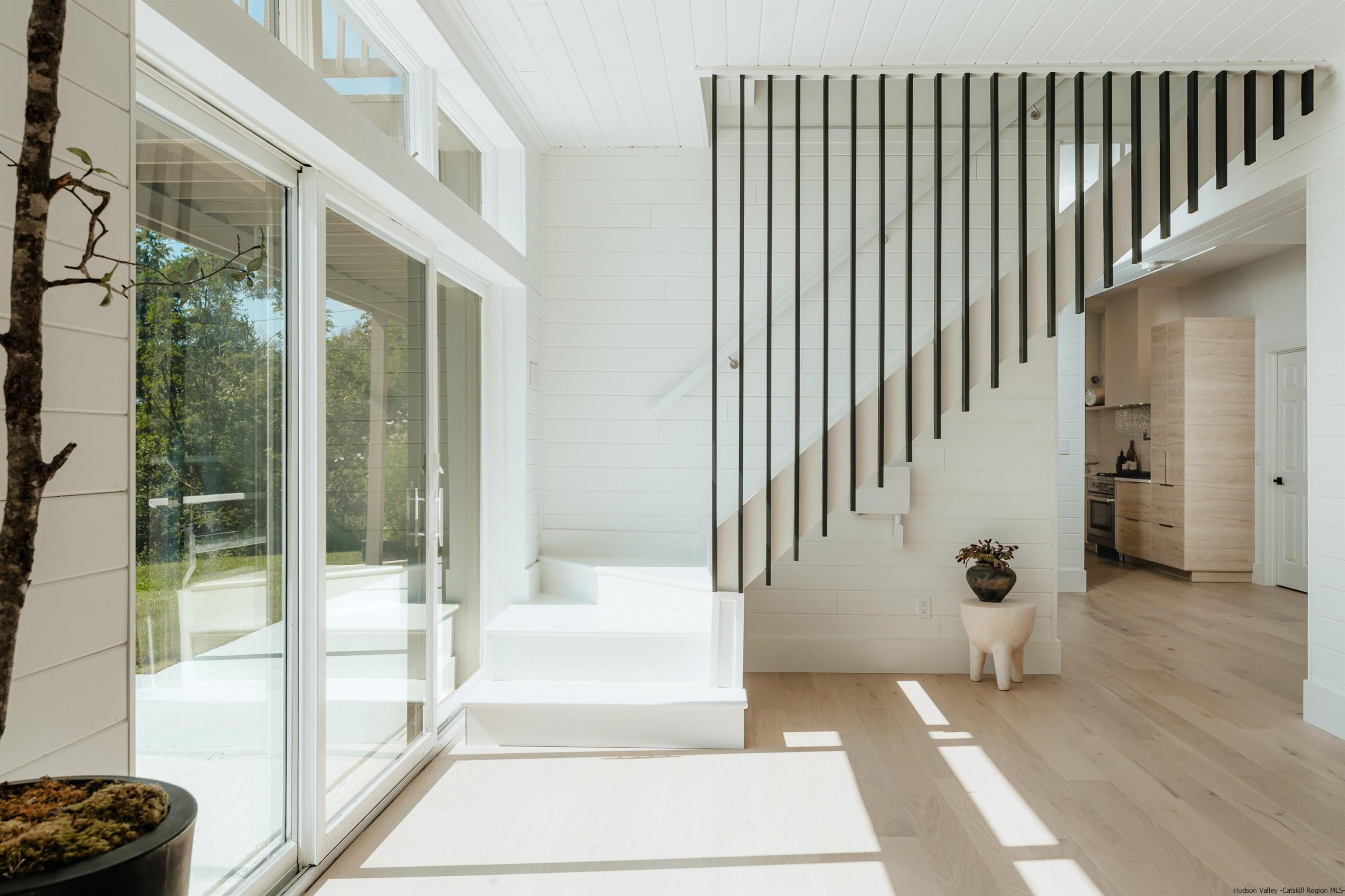 187 Bloom Road Barryville, NY 12719 - Photo 11 of 35 a view of a balcony with wooden floor and floor to ceiling window