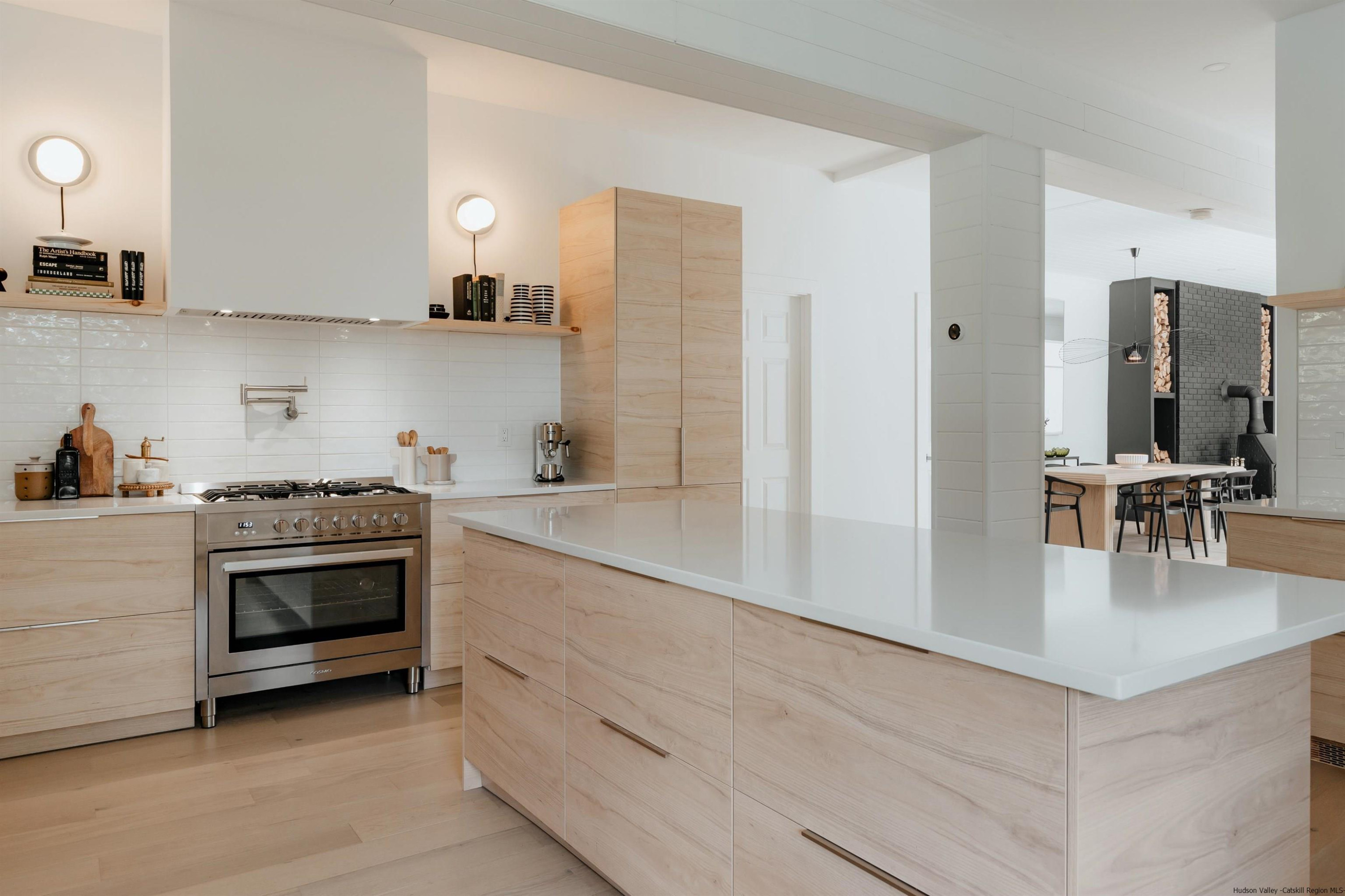 187 Bloom Road Barryville, NY 12719 - Photo 15 of 35 a kitchen with kitchen island a sink stainless steel appliances and cabinets