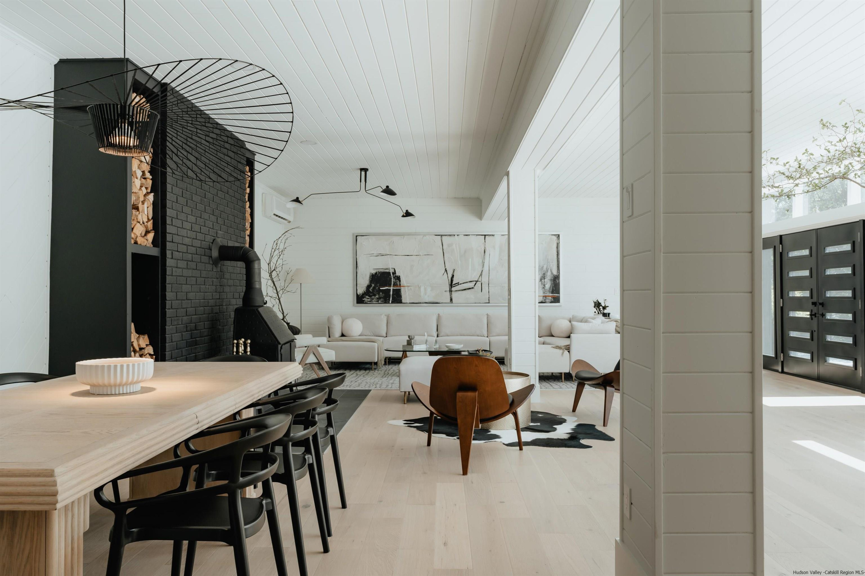 187 Bloom Road Barryville, NY 12719 - Photo 20 of 35 a view of a dining room with furniture and a chandelier