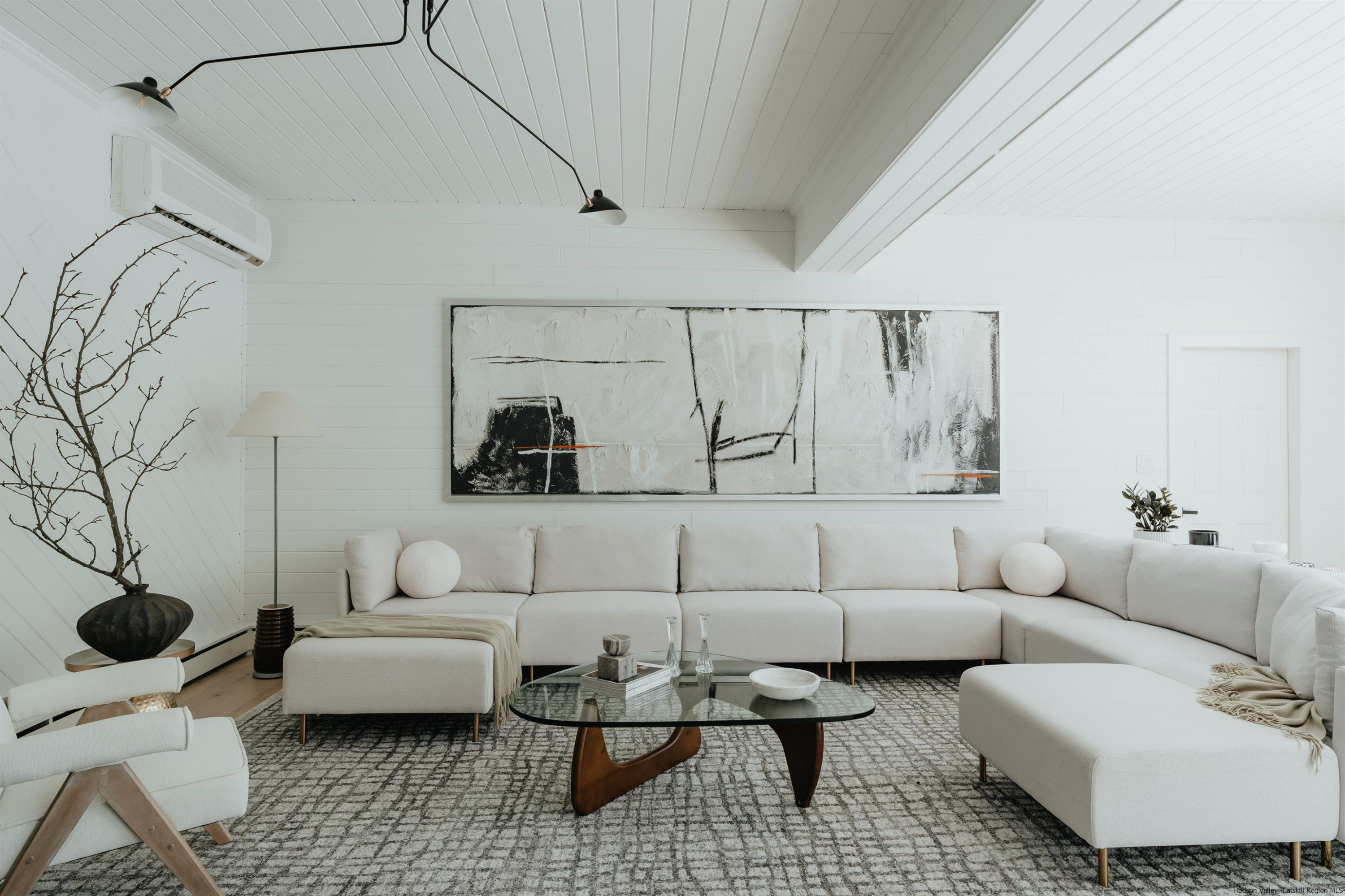 187 Bloom Road Barryville, NY 12719 - Photo 2 of 35 a living room with furniture and a rug