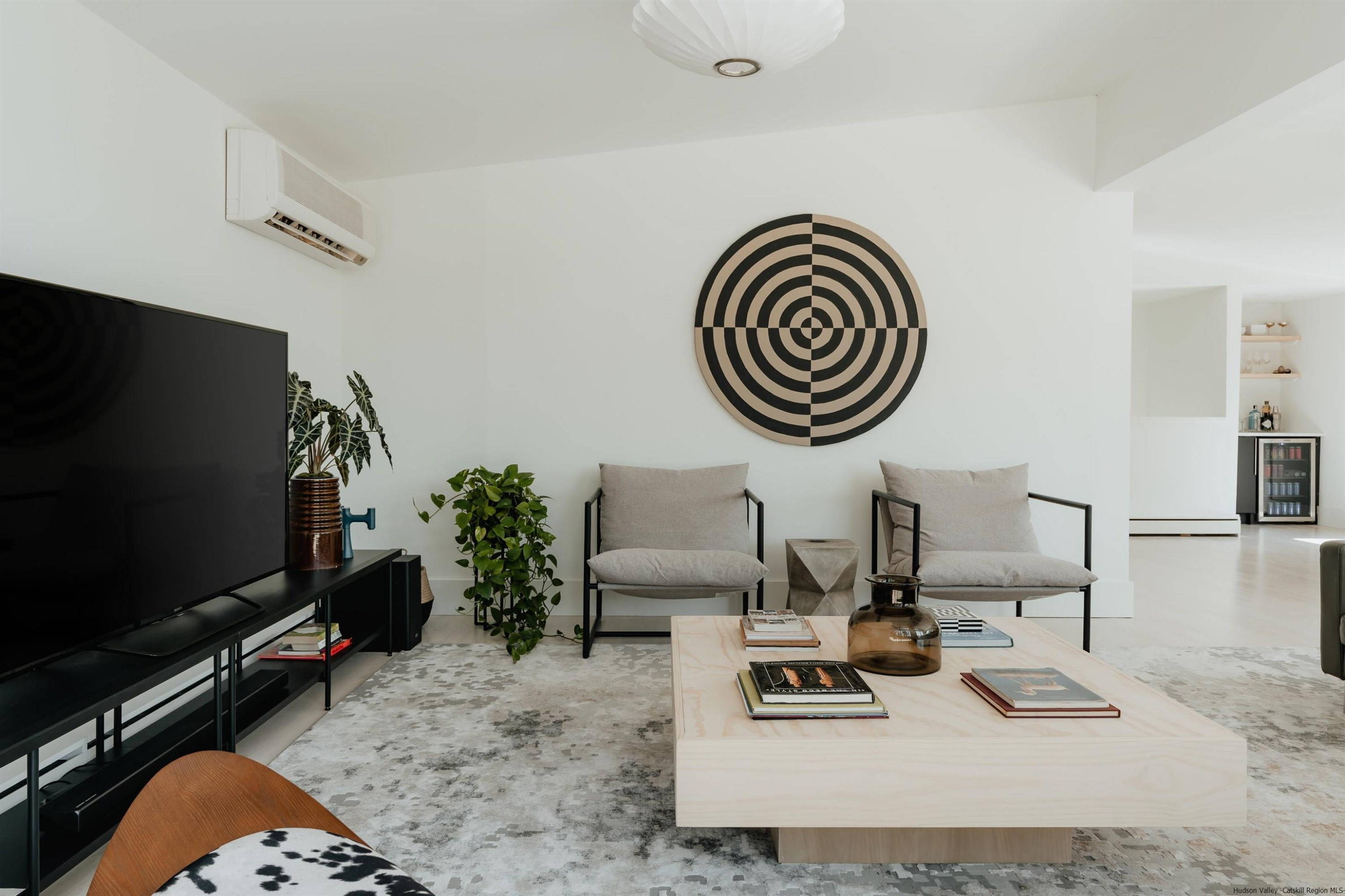 187 Bloom Road Barryville, NY 12719 - Photo 24 of 35 a living room with furniture and a flat screen tv
