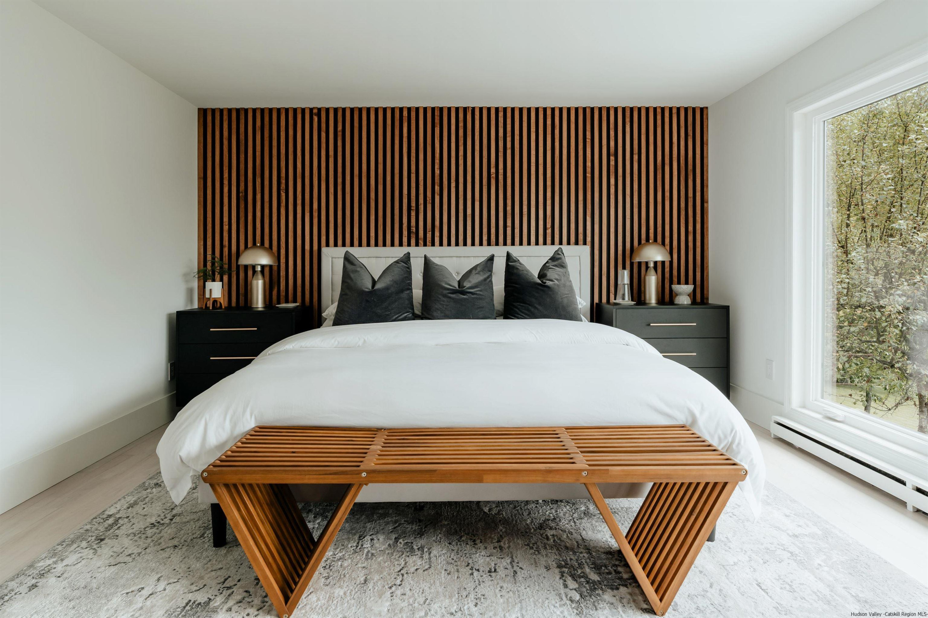 187 Bloom Road Barryville, NY 12719 - Photo 27 of 35 a bed sitting in a bedroom next to a window