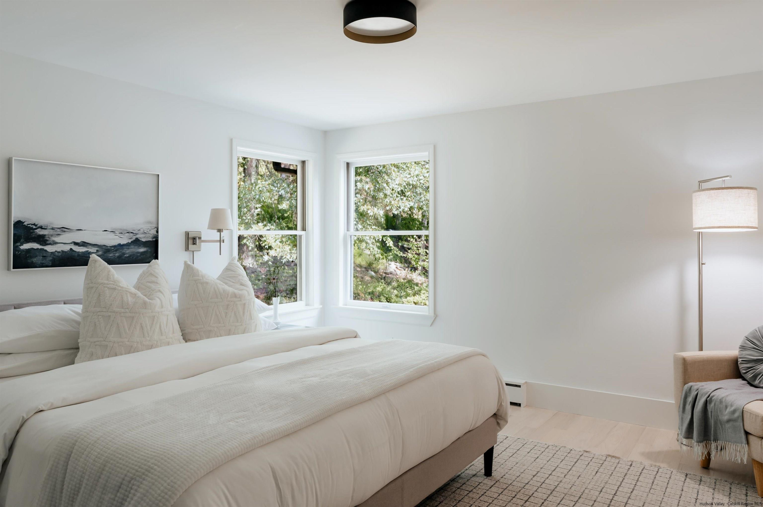 187 Bloom Road Barryville, NY 12719 - Photo 28 of 35 a bedroom with a bed and a large window