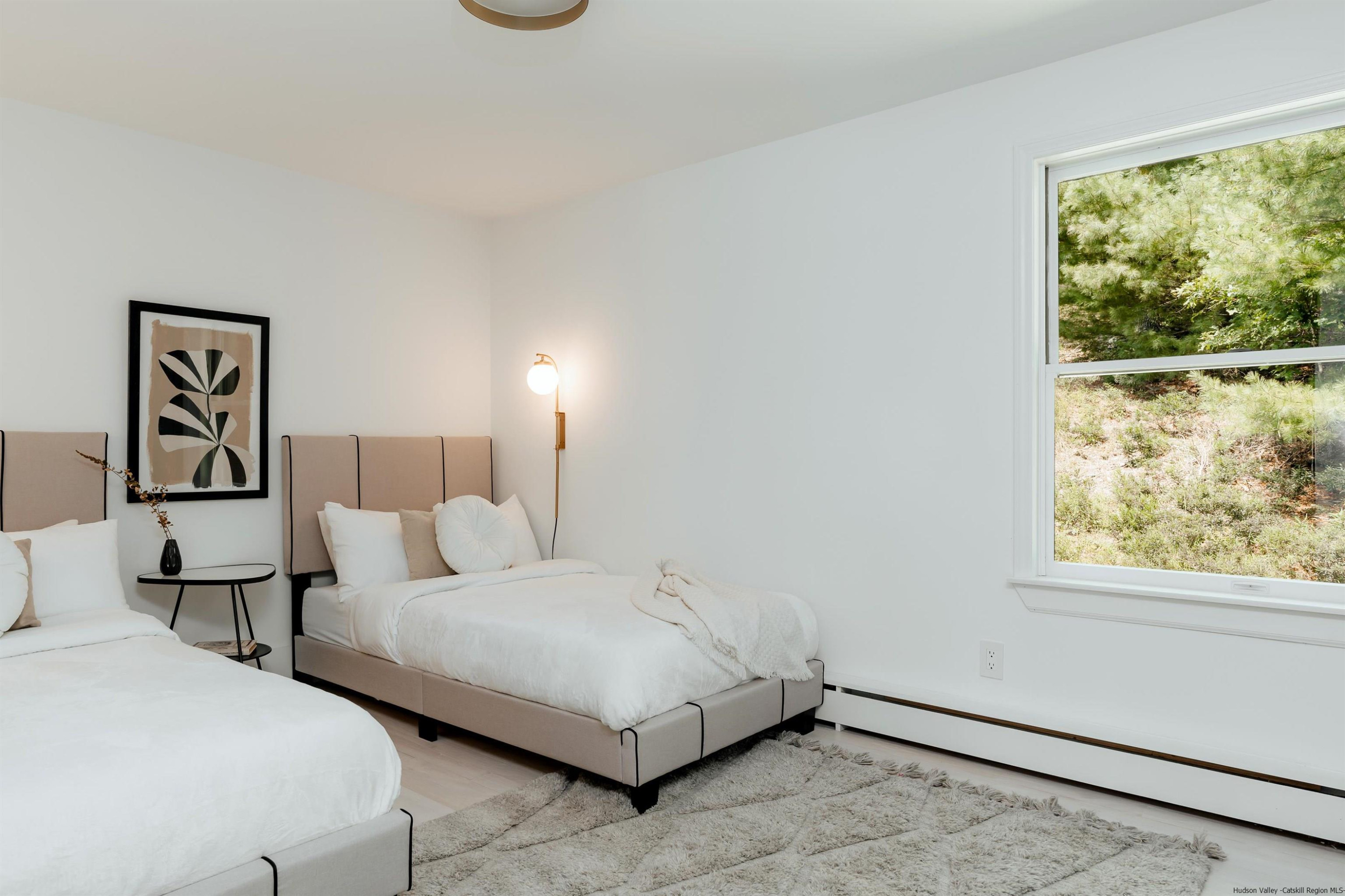 187 Bloom Road Barryville, NY 12719 - Photo 29 of 35 a bedroom with bed and a window