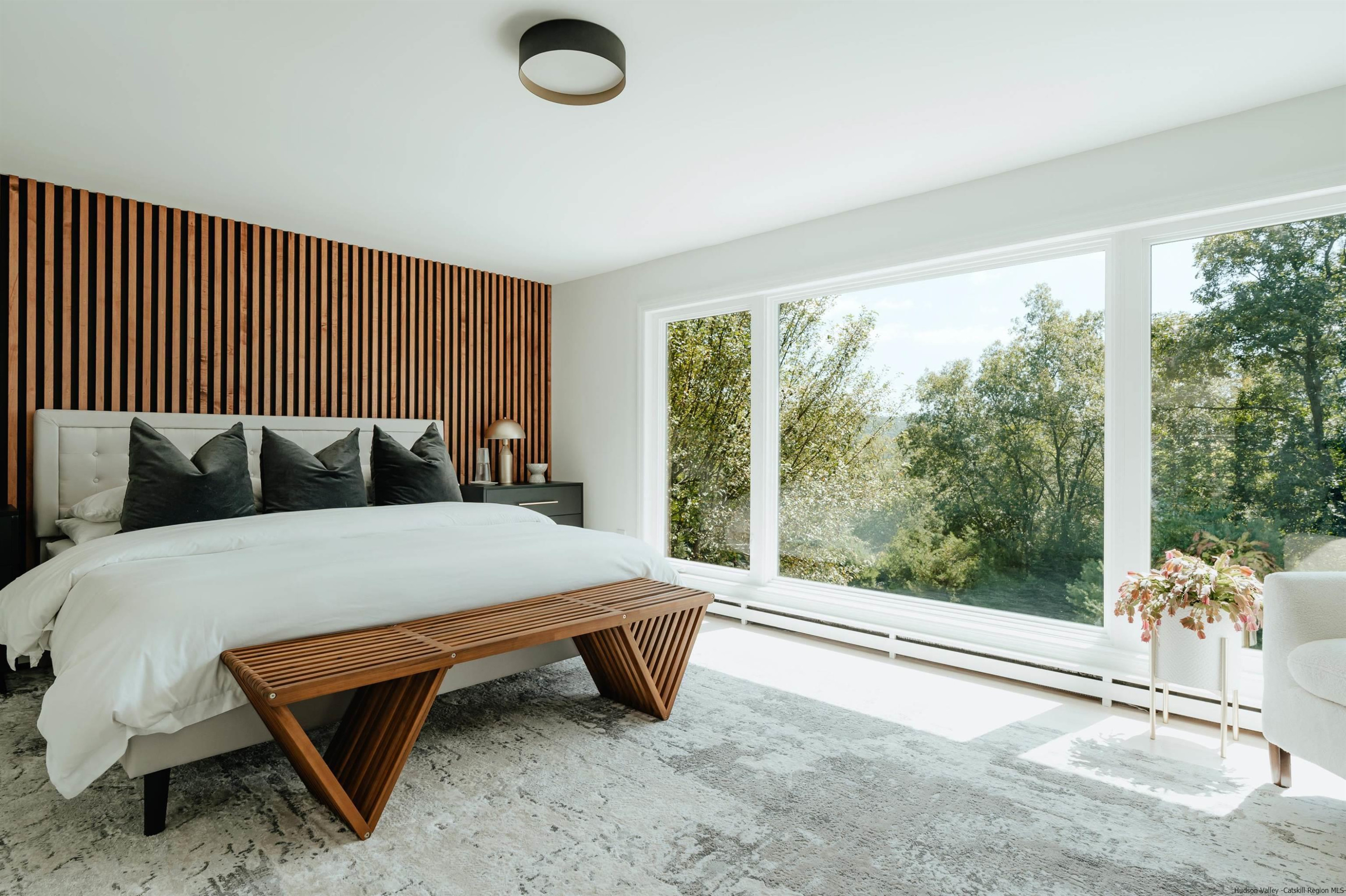 187 Bloom Road Barryville, NY 12719 - Photo 6 of 35 a bed sitting in a bedroom next to a window