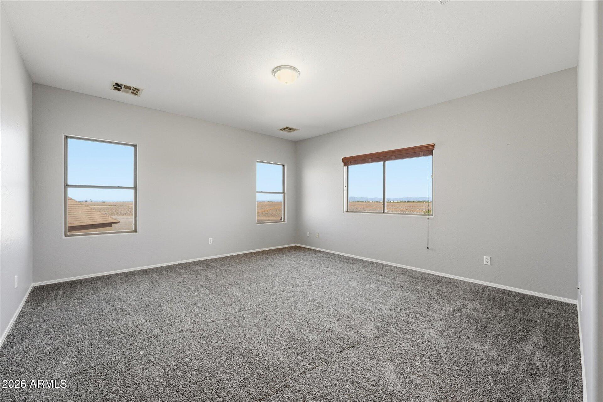 9934 East Hay Loft Road Florence, AZ 85132 - Photo 15 of 38 20-020-primary-bedroom