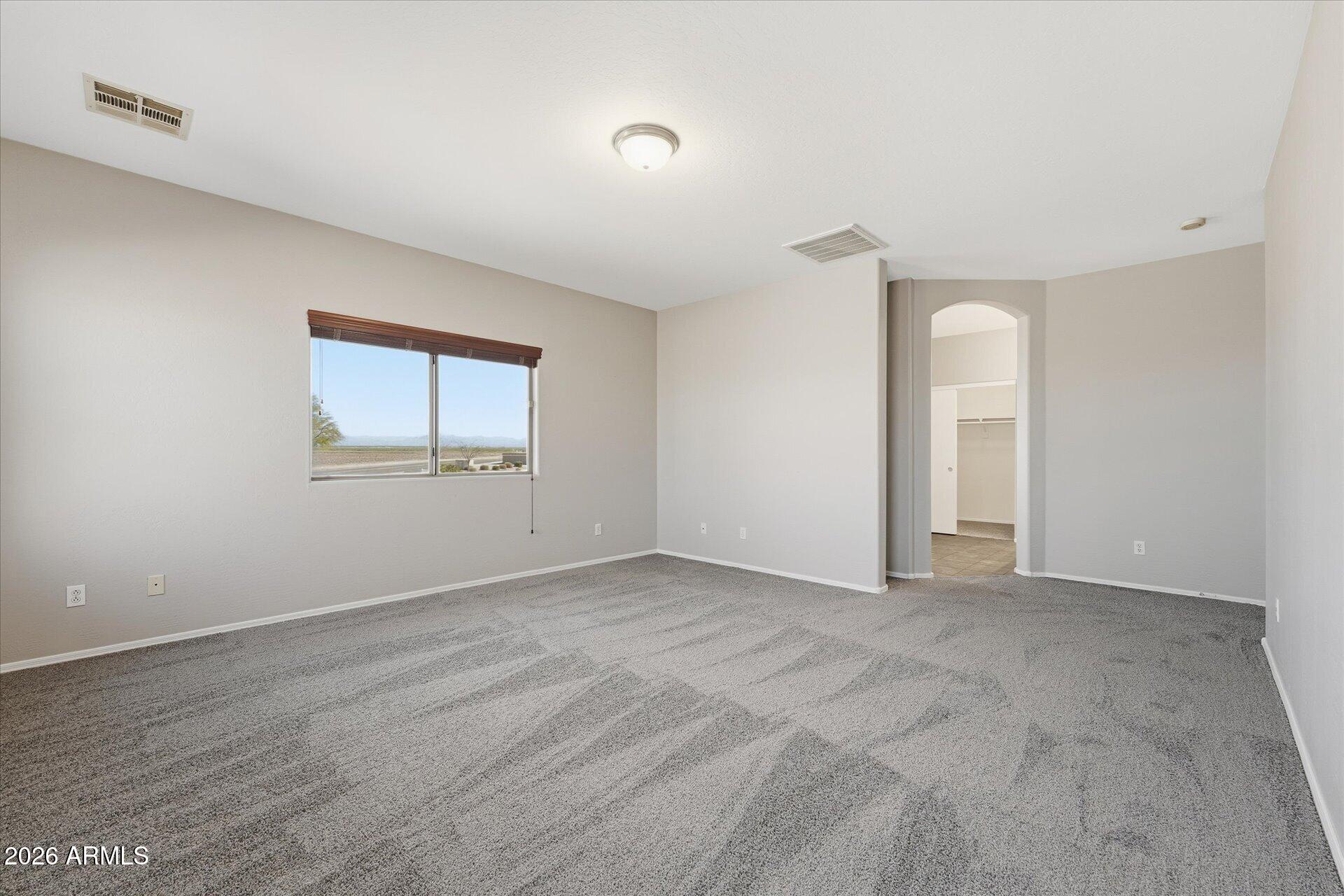 9934 East Hay Loft Road Florence, AZ 85132 - Photo 16 of 38 21-021-primary-bedroom