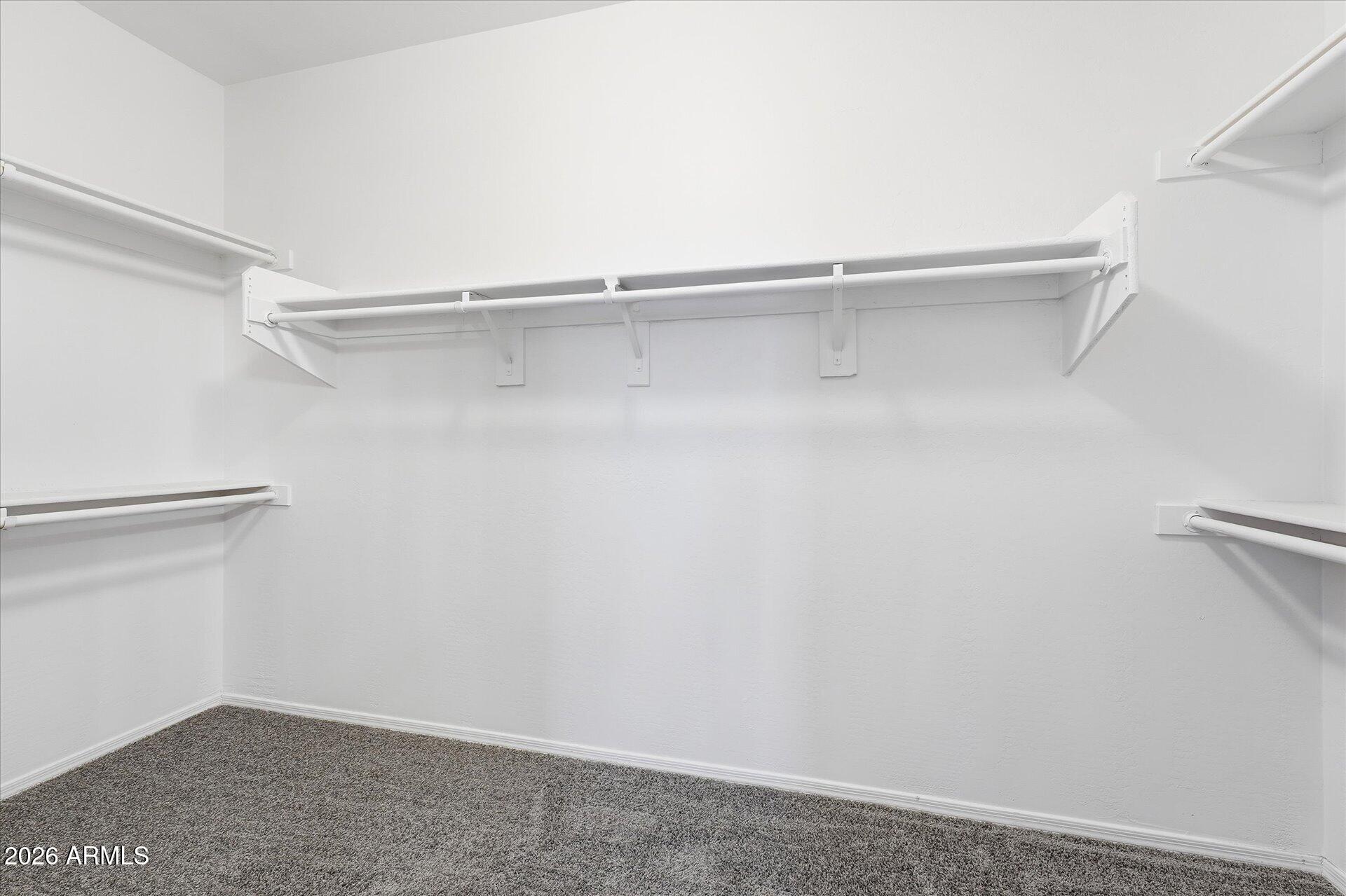 9934 East Hay Loft Road Florence, AZ 85132 - Photo 19 of 38 24-024-primary-closet