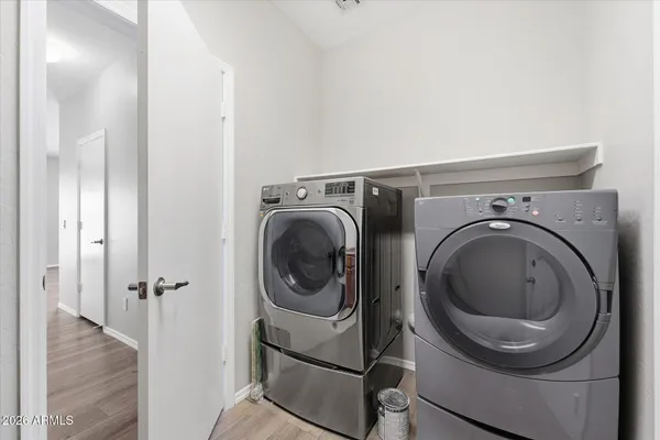 a utility room with dryer and washer
