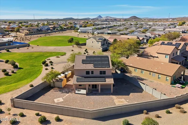 an aerial view of a house with a ocean view