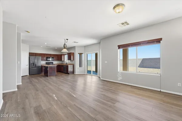 a living room with furniture and kitchen view