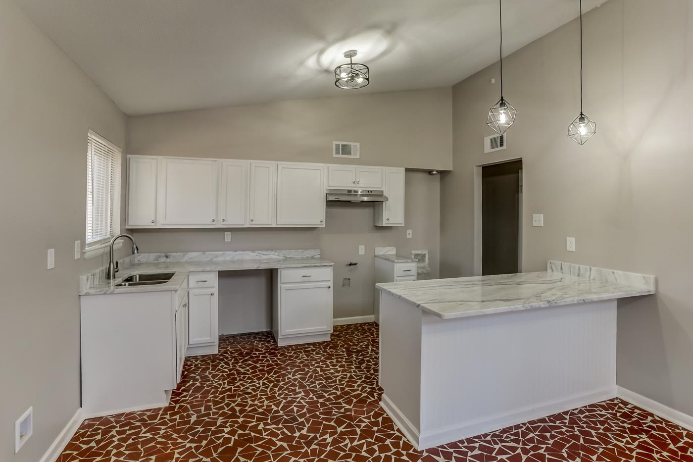 5244 Whitworth Road Memphis, TN 38116 - Photo 6 of 14 a kitchen with a sink appliances and cabinets