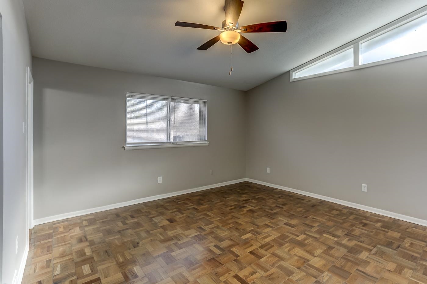 5244 Whitworth Road Memphis, TN 38116 - Photo 10 of 14 an empty room with windows and fan