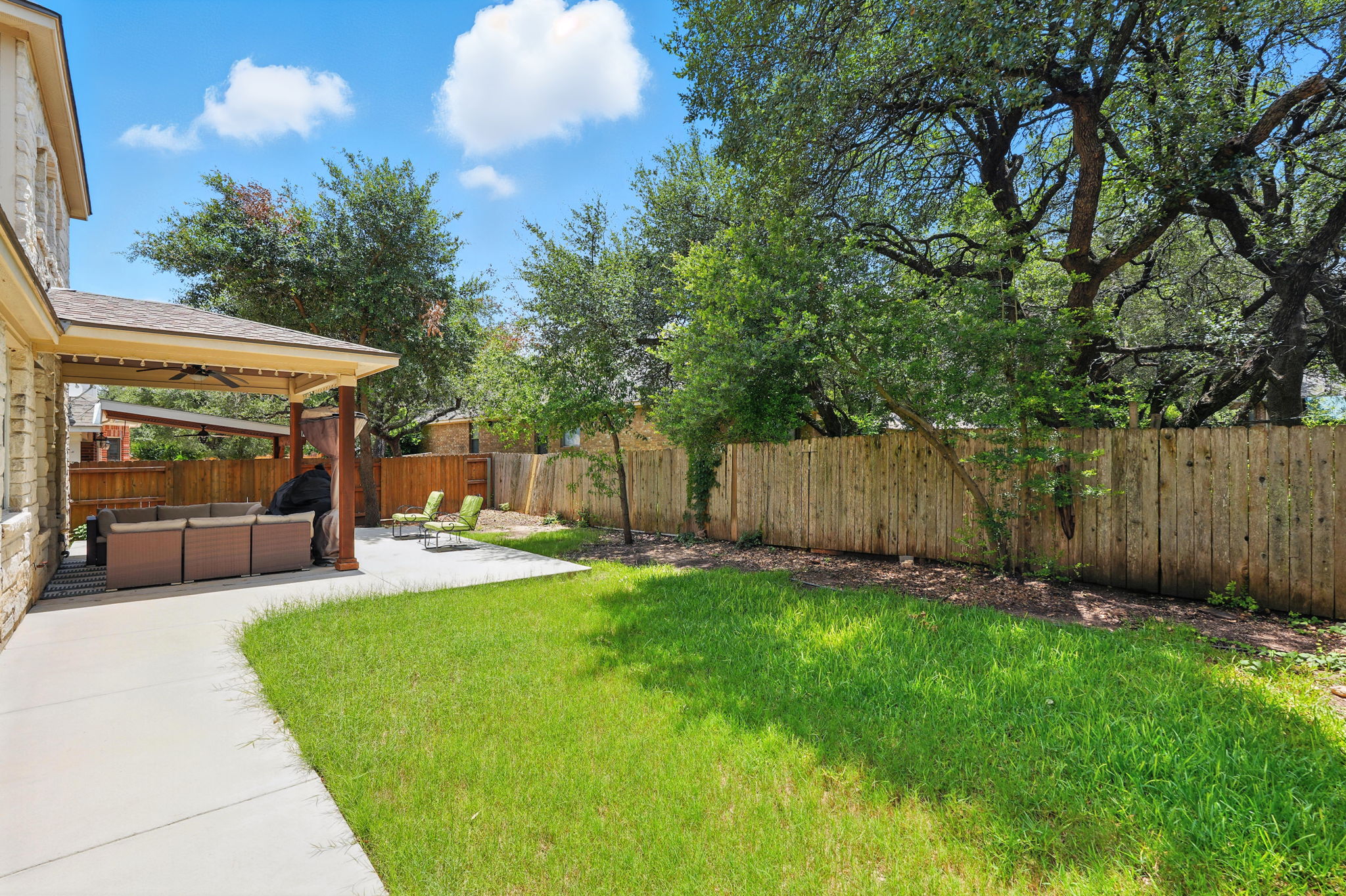 1802 Misty Ridge Leander, TX 78641 - Photo 36 of 39 Fenced backyard with an outdoor living space and a patio area