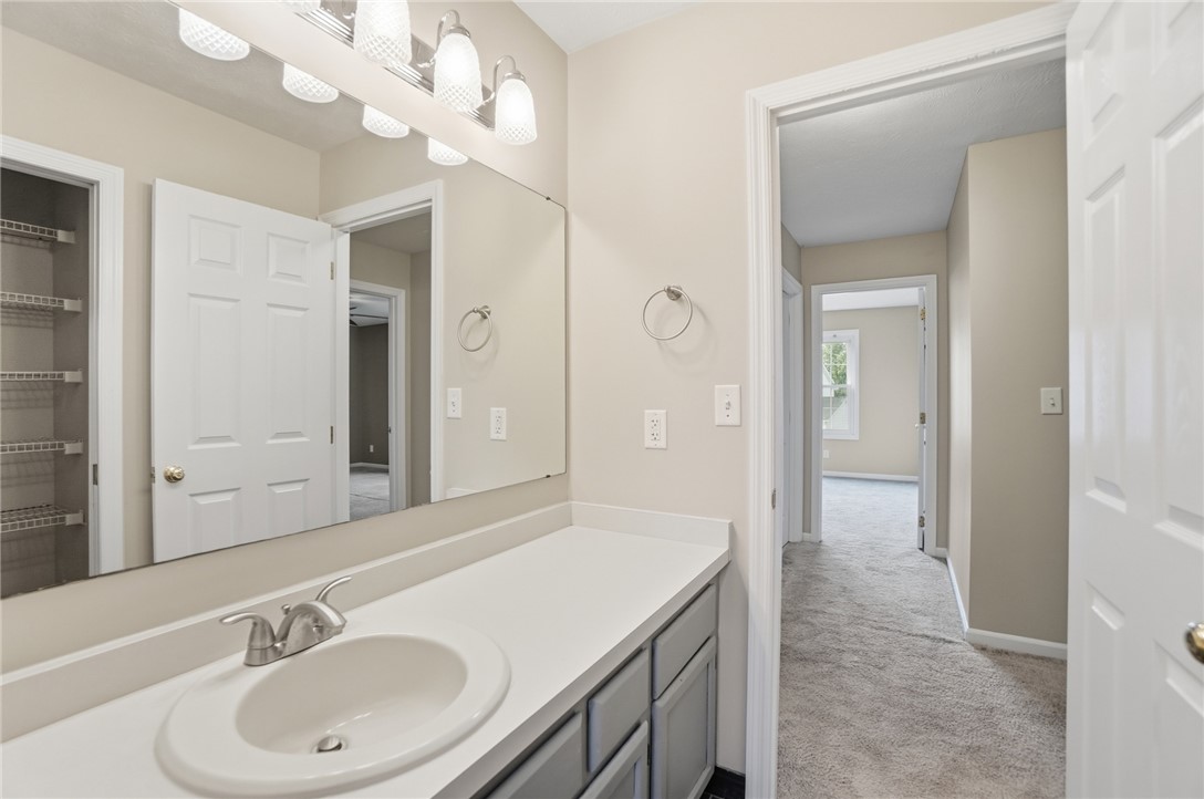 10 Chase Court Springboro, OH 45066 - Photo 52 of 75 This bright bathroom features a spacious vanity with ample counter space and a large mirror.