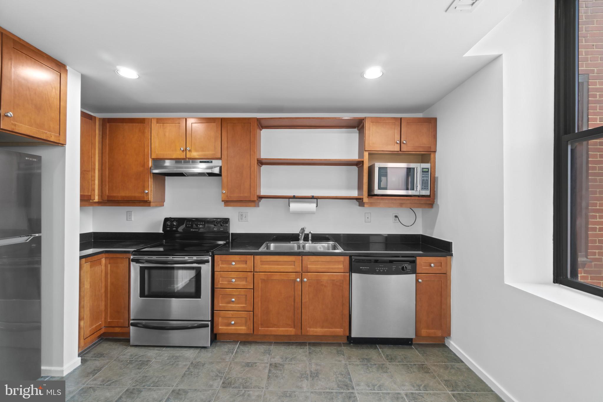1211 Light Street, Unit 211 Baltimore, MD 21230 - Photo 20 of 40 Eat-In Kitchen With Stainless Steel Appliances