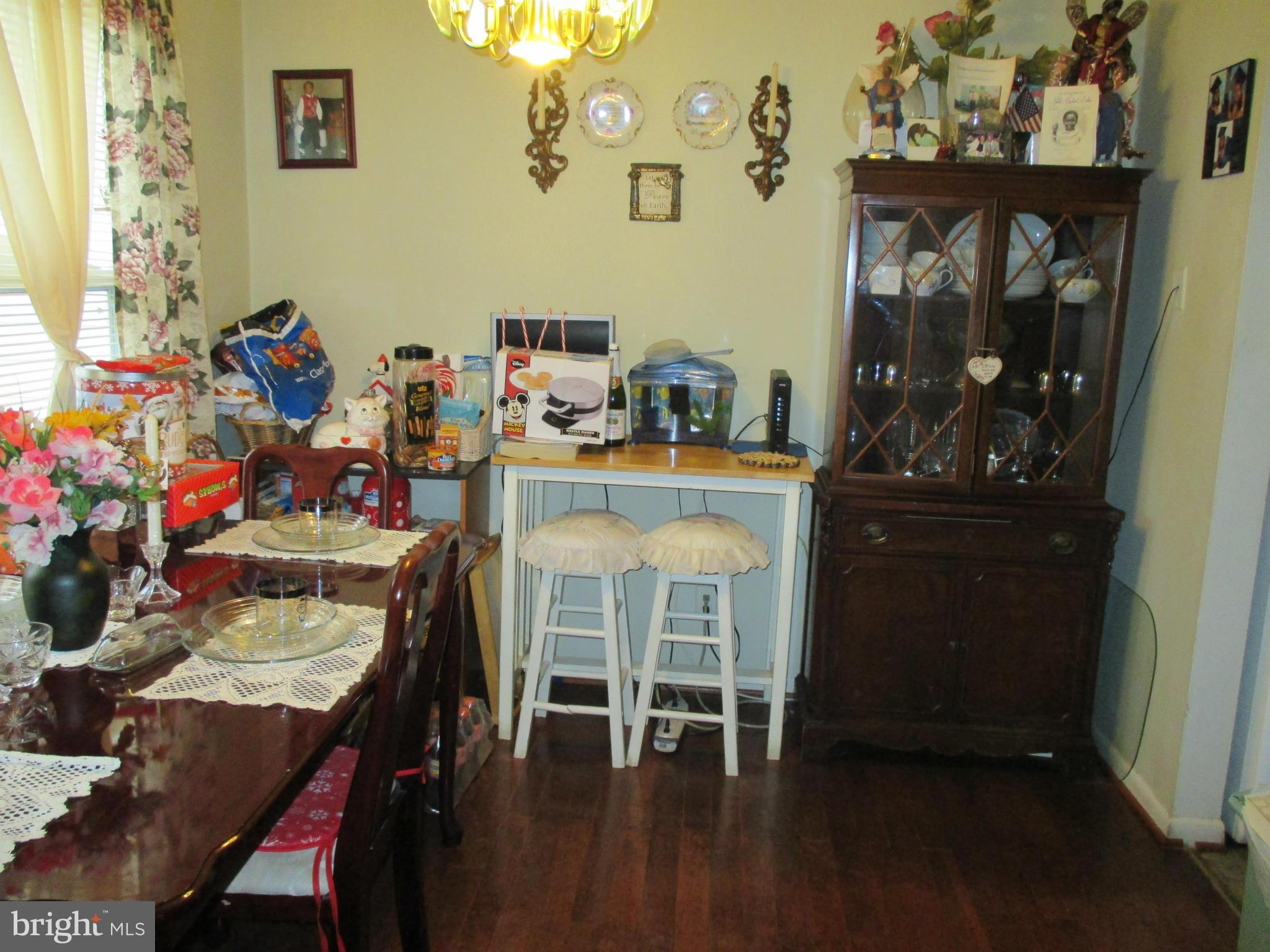 17428 Hoskinson Road Poolesville, MD 20837 - Photo 2 of 12 a dining room with furniture and wooden floor
