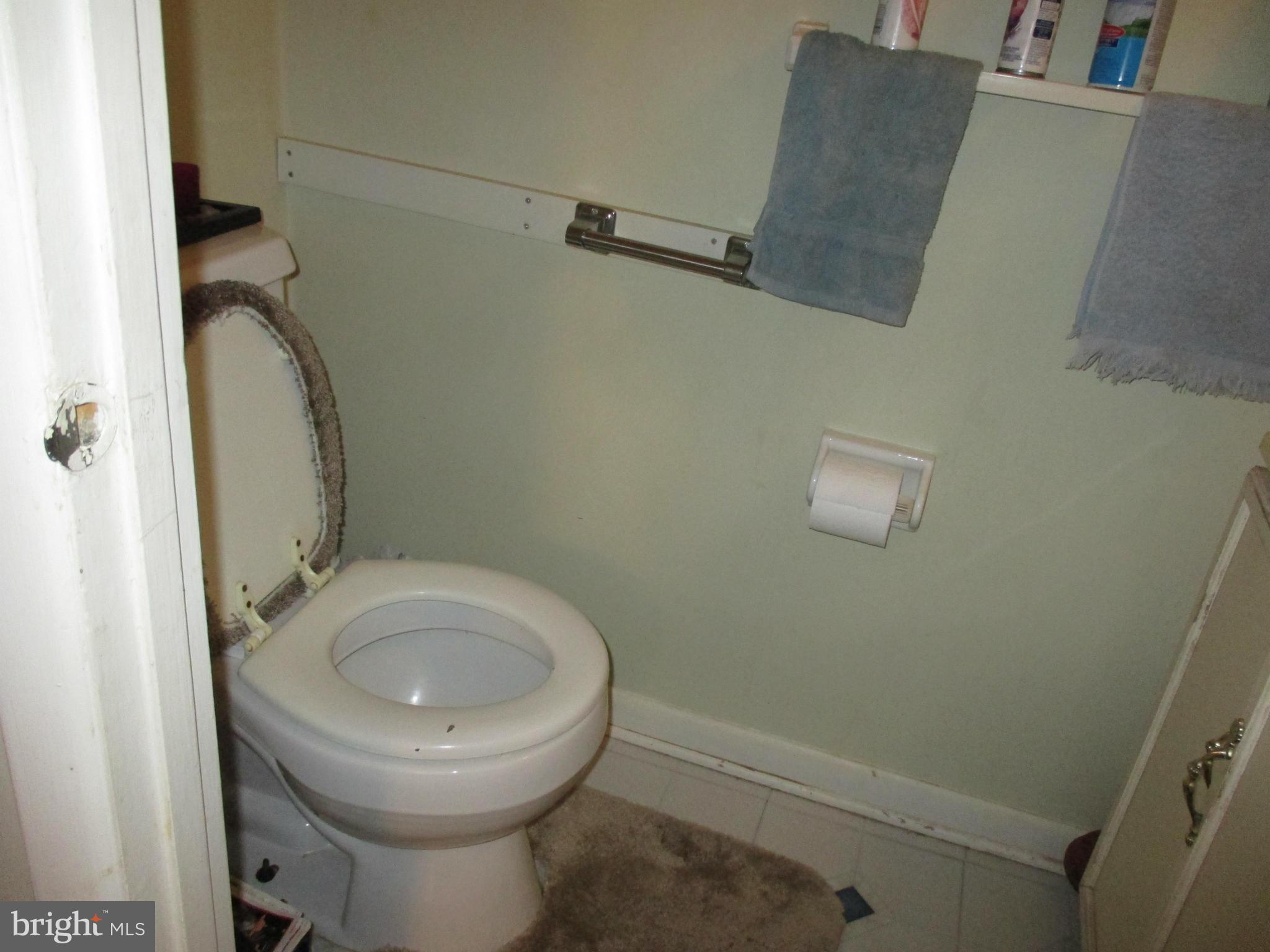 17428 Hoskinson Road Poolesville, MD 20837 - Photo 3 of 12 a bathroom with a toilet and a sink