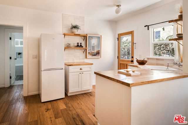 a kitchen with a sink and refrigerator
