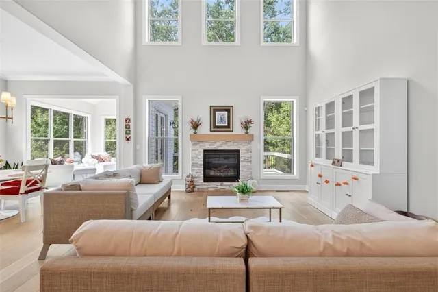 a living room with furniture and a chandelier