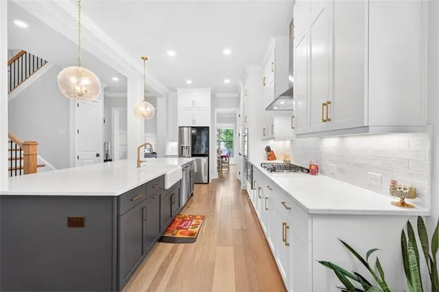 a view of a hallway with wooden floor and windows