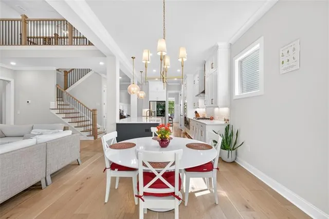 a living room with furniture ceiling fan and a flat screen tv