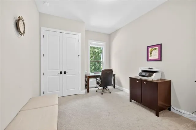 a kitchen with stainless steel appliances a refrigerator a sink dishwasher and a stove with wooden floor