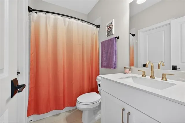 a spacious bathroom with a double vanity sink and a mirror