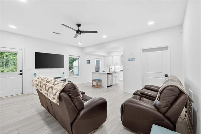 a front view of house with yard outdoor seating and green space