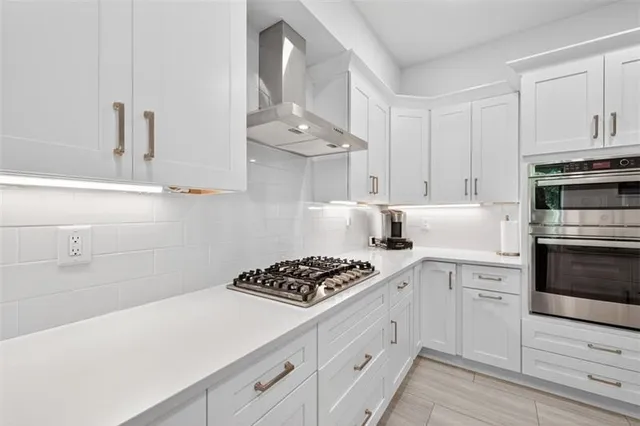 a front view of a house with yard and outdoor seating