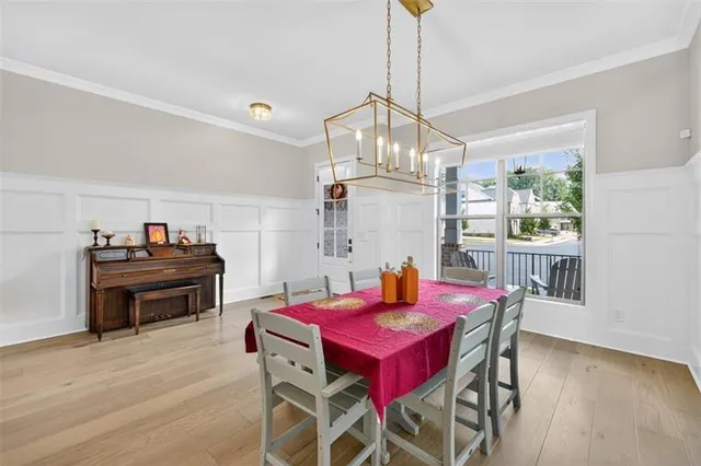 a kitchen with kitchen island granite countertop a table and chairs in it