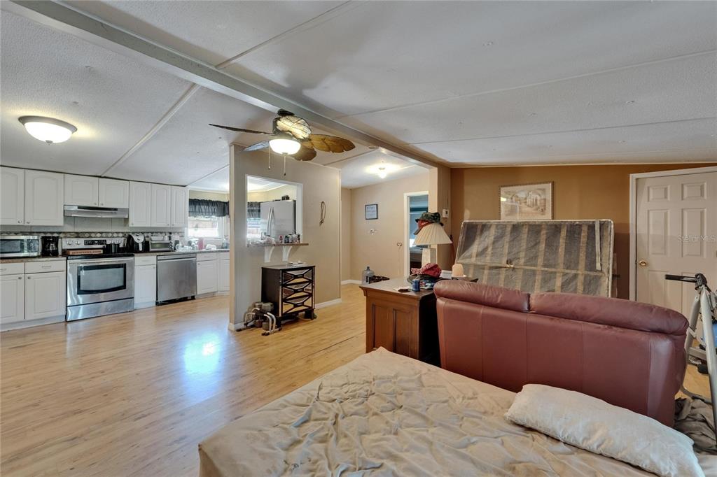 13907 Raulerson Road, Unit PARCEL A Riverview, FL 33569 - Photo 11 of 30 a living room with furniture and kitchen view